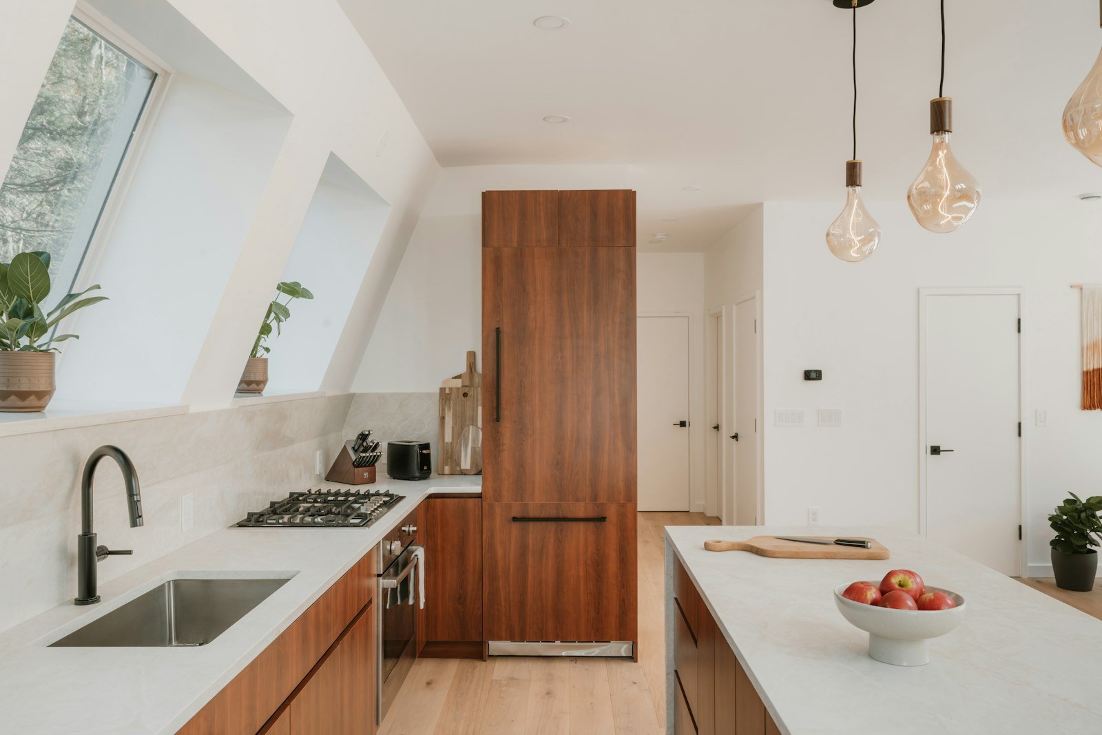 Modern kitchen with natural wood cabinets and island